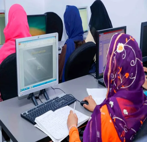 Trainee taking notes beside a computer during a Smart STEP lesson
